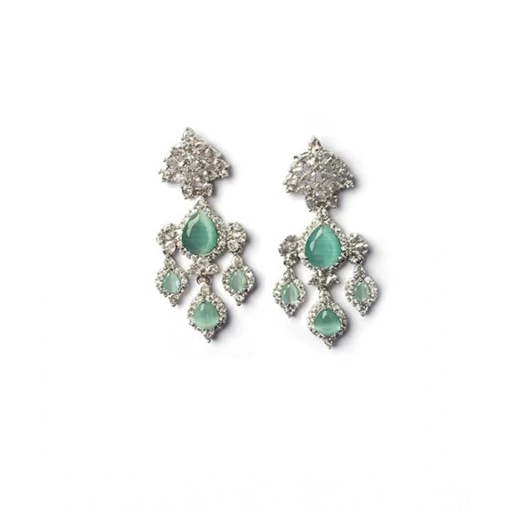 Women's brass silver plated turquoise drop earrings, stylish jewelry accessory on display