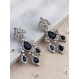 Women's brass silver plated blue drop earrings, elegant jewelry accessory on display