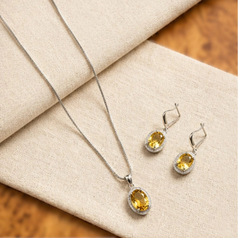 Women's yellow brass silver plated pendant set for jewelry accessory, close-up view of the pendant set on a soft cloth