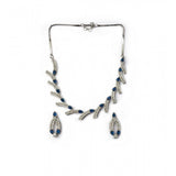 Blue brass silver-plated women's necklace set, sparkling jewelry pieces on display