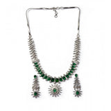 Green brass silver-plated necklace set for women, elegant jewelry accessories on display
