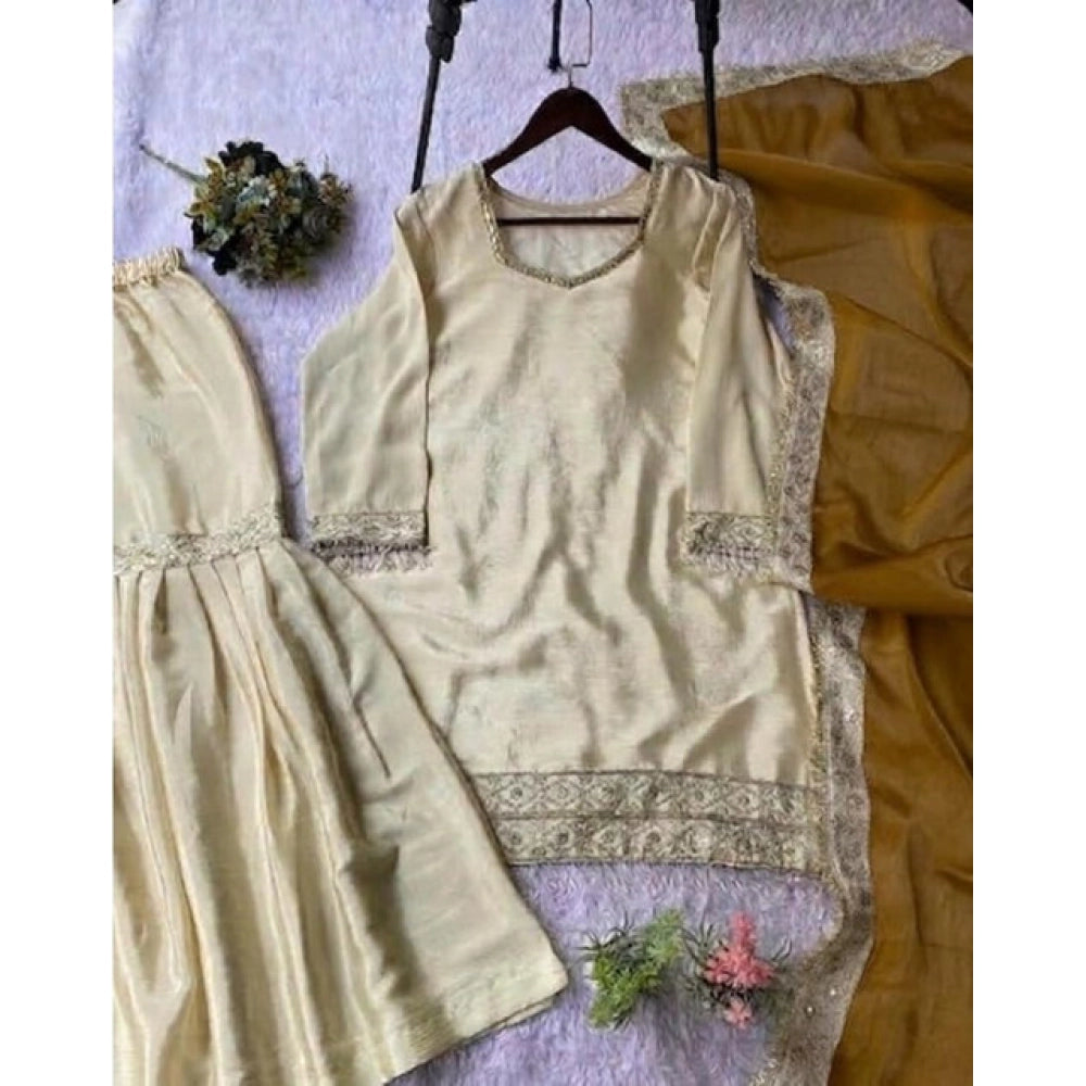 Cream & yellow silk embroidered 3/4th sleeve V-neck kurti set with sharara pant and dupatta, traditional Indian women's wear on display