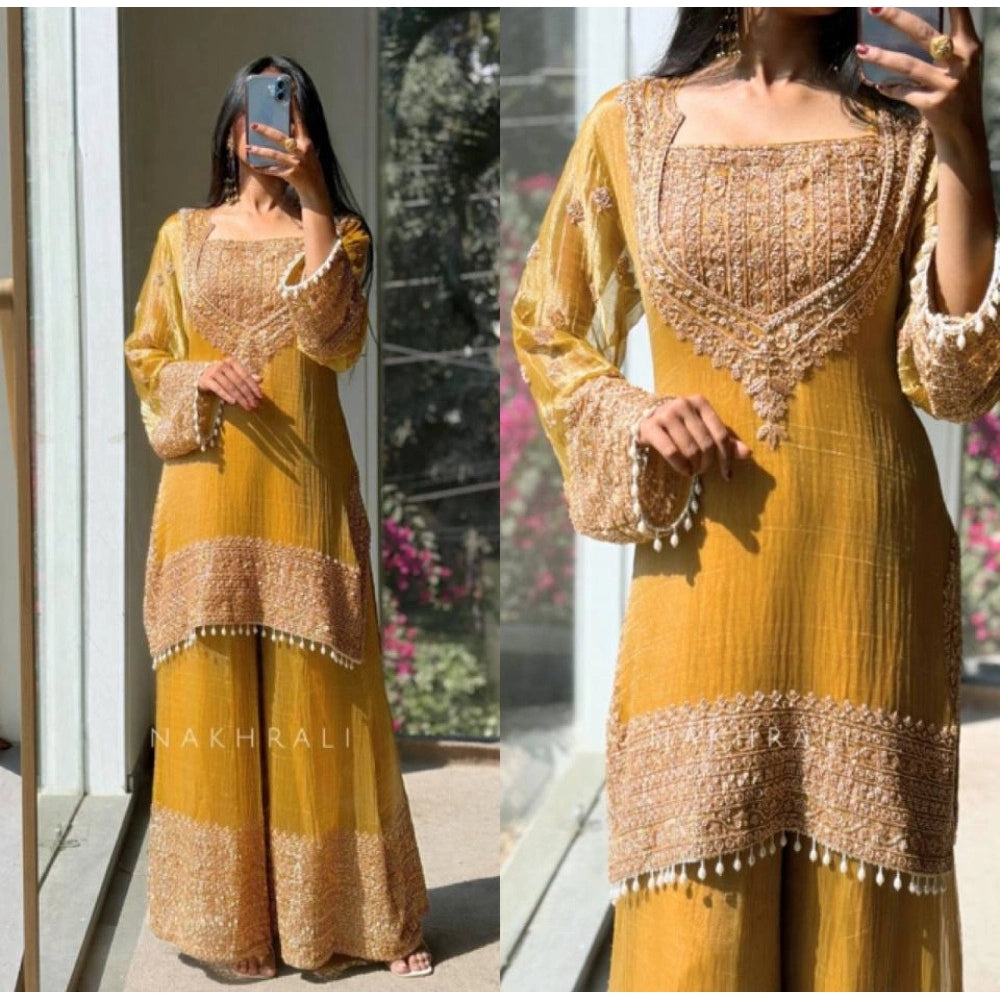 Yellow silk embroidered round kurti set with sharara pant and dupatta, intricate pattern detail