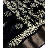 Black cotton silk printed saree with unstitched blouse, intricate design on display