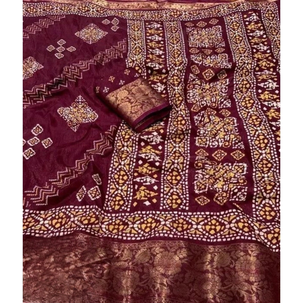 Women's wine-colored cotton silk printed saree with unstitched blouse, vibrant pattern showcased on mannequin