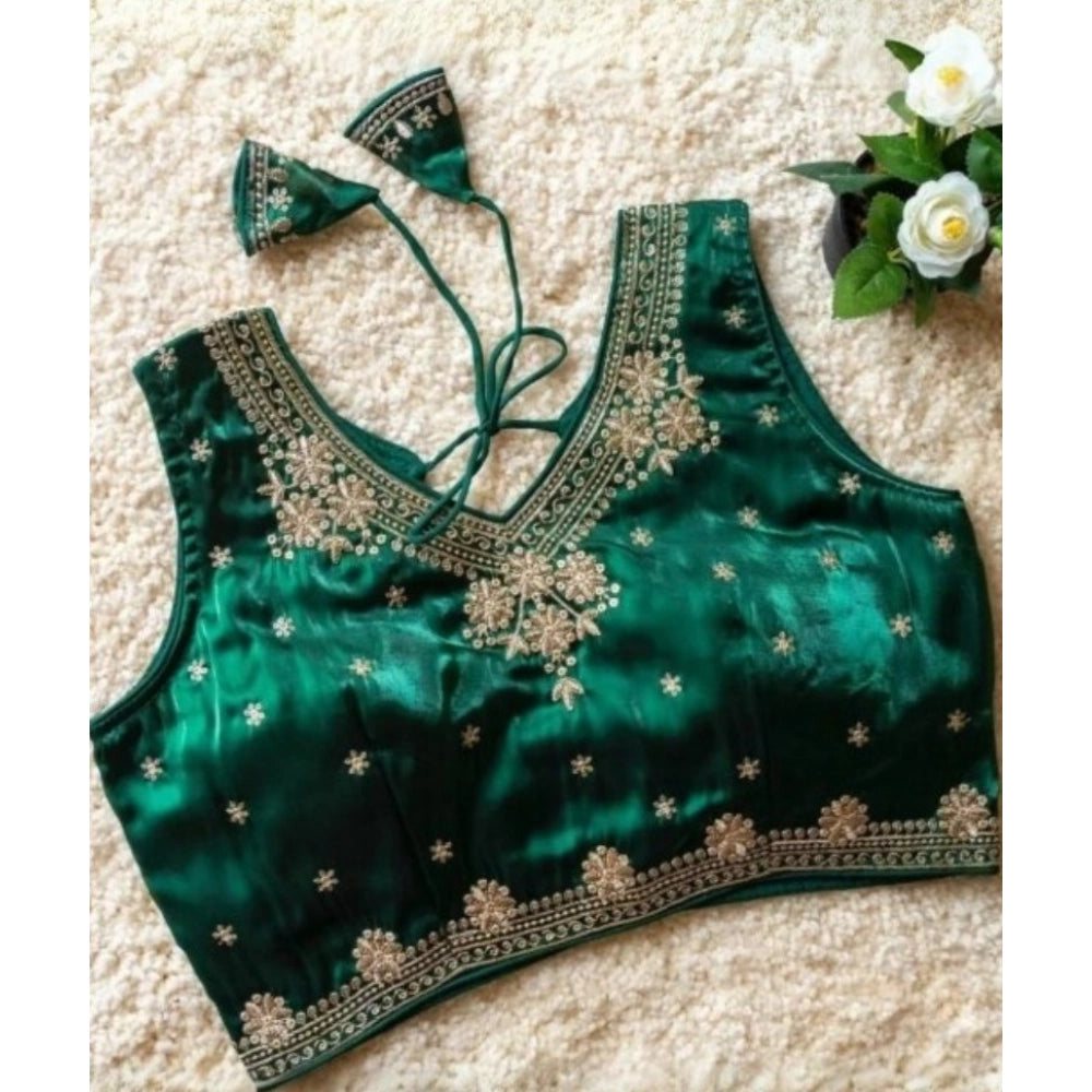 Green silk embroidered v-neck sleeveless blouse with padded detail on display