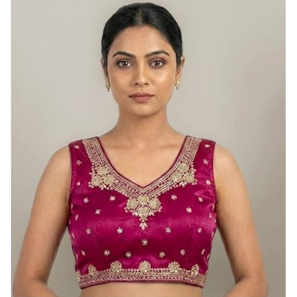 Pink silk embroidered v-neck sleeveless padded blouse with hook closure on mannequin