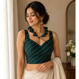 Green silk embellished sweetheart neck, sleeveless padded blouse for women on mannequin