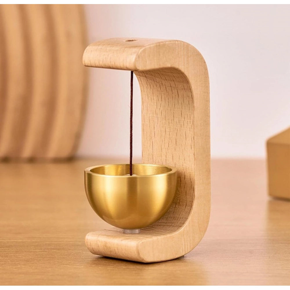 { "alt_text": "Gold magnetic doorbell with natural wooden base, adhesive door chime for home entrance or garden gate" }