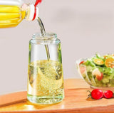 Black 2-in-1 oil dispenser bottle that functions as a spray bottle for cooking oil and liquids