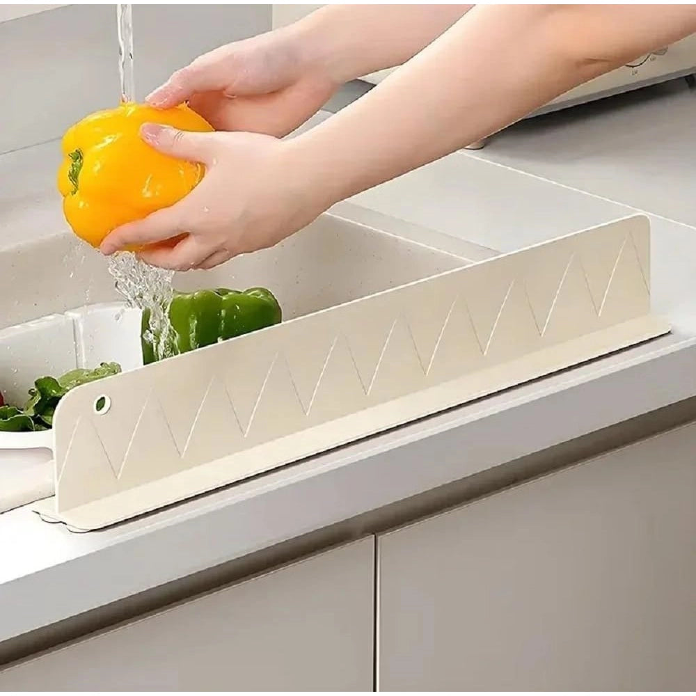{ "alt_text": "Multicolor silicone sink splash guard for kitchen counter, waterproof anti-splash protection, suction cup drain cover" }