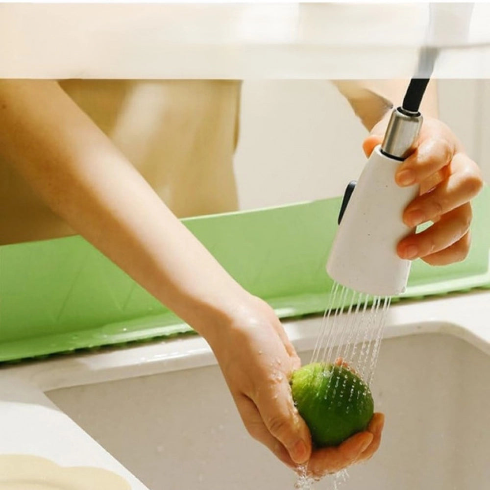 { "alt_text": "Multicolor silicone sink splash guard for kitchen counter, waterproof anti-splash protection, suction cup drain cover" }