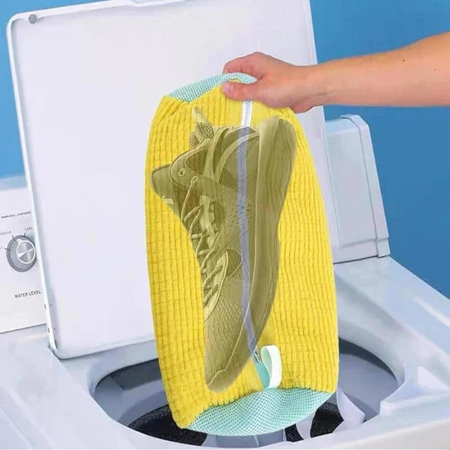 Yellow laundry shoe washing bag designed for use in washing machines and dryers, protecting shoes and machine.