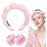 { "alt_text": "Pink elastic spa headband wristband set, absorbent beauty routine accessories for skincare and makeup" }