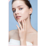 { "alt_text": "Pink spray hair identifier for facial shaving, dermaplaning tool, hypoallergenic skincare accessory" }