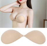 Beige and black adhesive silicone bra pads for strapless or backless dresses, providing a lifted and fuller look
