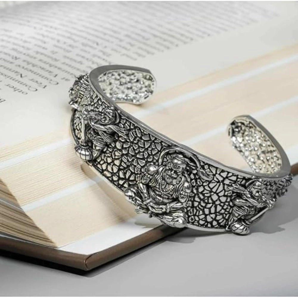 { "alt_text": "Silver metal half wrist kada for Lord Hanuman devotees, spiritual protection jewelry, inner strength accessory" }