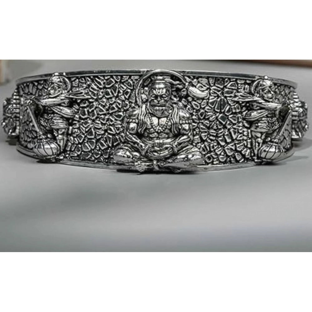{ "alt_text": "Silver metal half wrist kada for Lord Hanuman devotees, spiritual protection jewelry, inner strength accessory" }