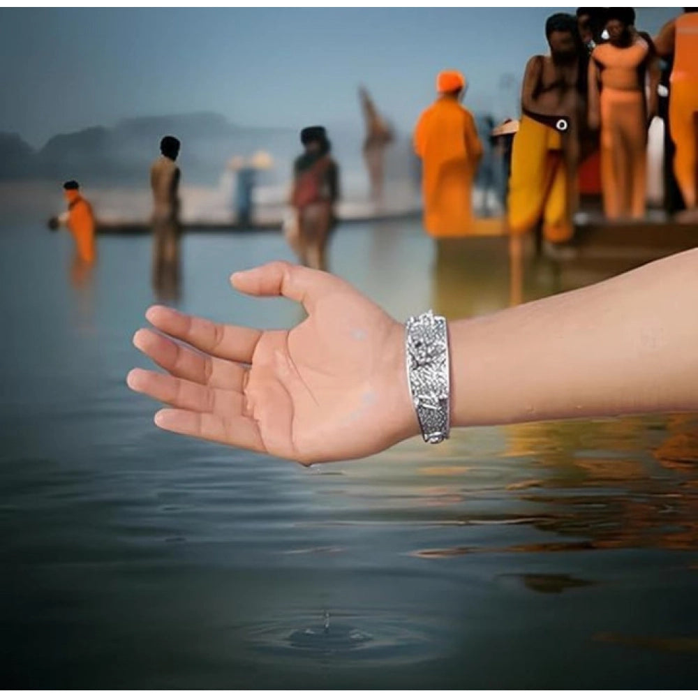 { "alt_text": "Silver metal half wrist kada for Lord Hanuman devotees, spiritual protection jewelry, inner strength accessory" }