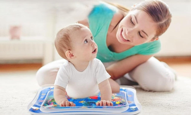 Multicolor sensory play mat for infants, featuring moving shapes and colors for motor skill development
