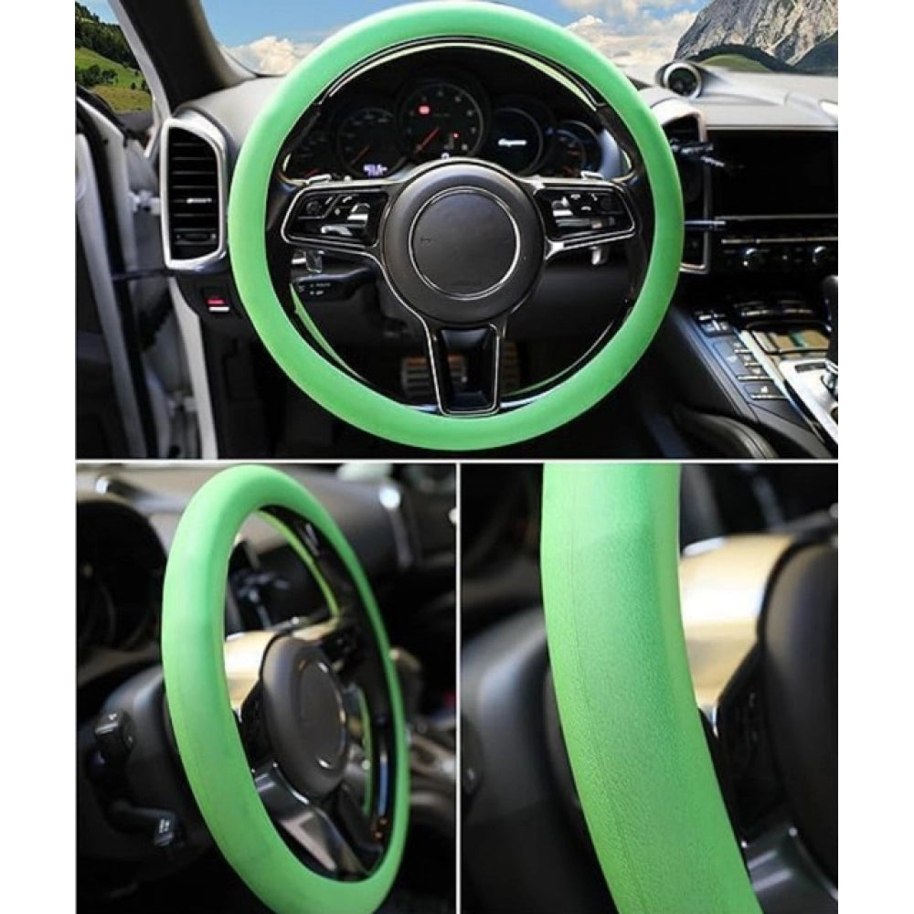 { "alt_text": "Green silicone universal steering wheel cover for car, anti-slip grip automotive accessory, superior protection" }