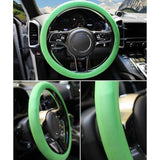 { "alt_text": "Green silicone universal steering wheel cover for car, anti-slip grip automotive accessory, superior protection" }