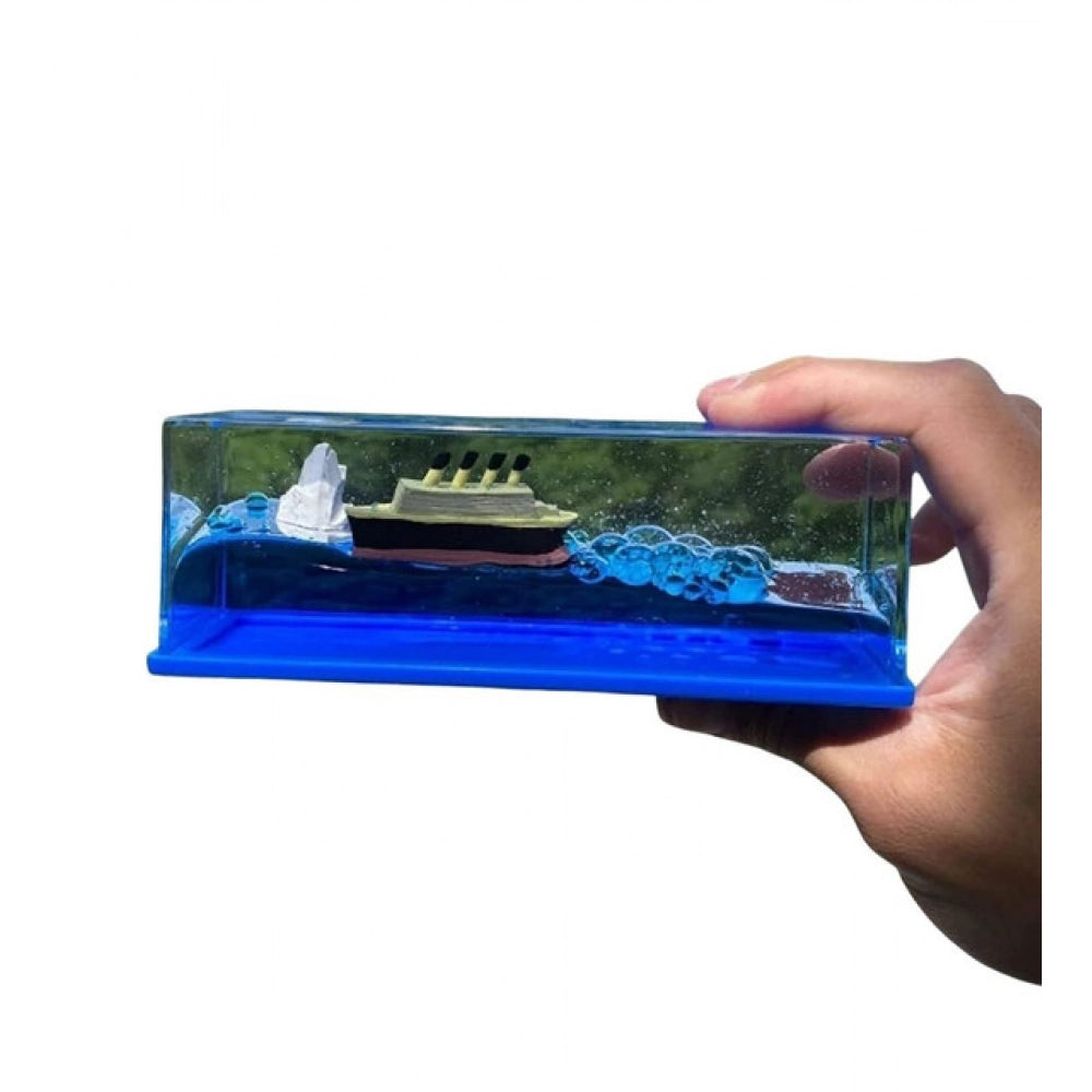 { "alt_text": "Blue PVC decorative liquid wave cruise ship ornament, perfect desk paperweight for home office decor" }