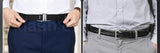 Black adjustable shirt tucker belt for men, designed to keep shirts neatly tucked and wrinkle-free