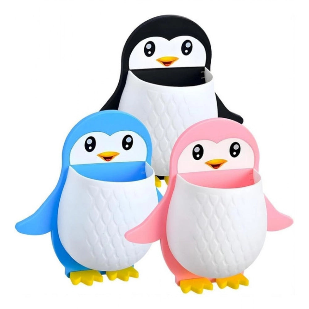 { "alt_text": "Multicolor plastic toothbrush holder set of 3, penguin design bathroom organizer for countertop storage" }