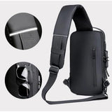 waterproof black sling backpack with adjustable strap, multiple pockets, USB charging port, suitable for office & outdoor activities