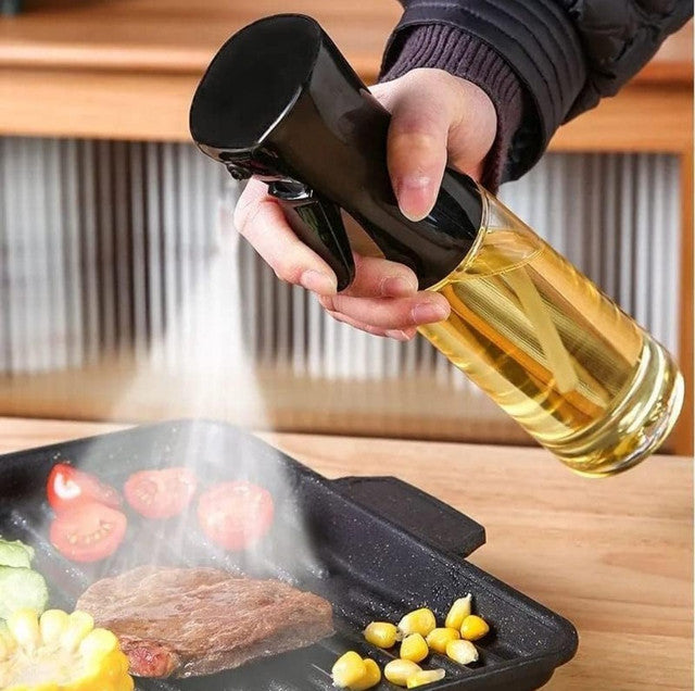 Black glass oil sprayer for cooking, featuring a transparent body and precision nozzle for even oil control