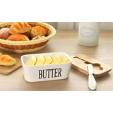 { "alt_text": "White ceramic butter box with bamboo lid, airtight storage container for fresh butter, kitchen countertop accessory" }