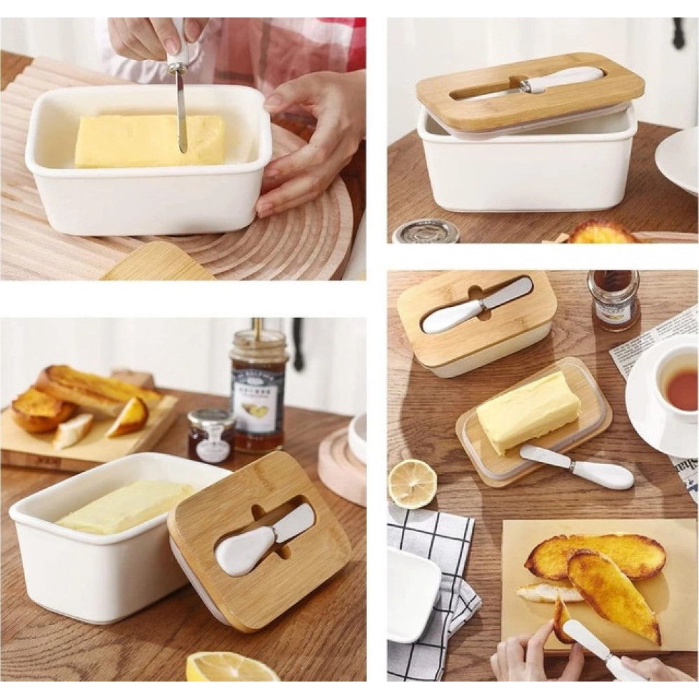 { "alt_text": "White ceramic butter box with bamboo lid, airtight storage container for fresh butter, kitchen countertop accessory" }