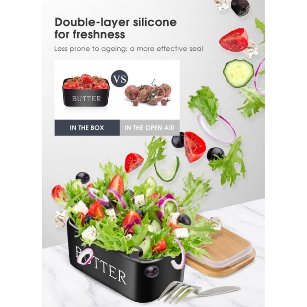 { "alt_text": "Black ceramic butter box with bamboo lid, airtight storage container for fresh butter, kitchen countertop accessory" }