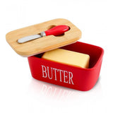 { "alt_text": "Red ceramic butter box with bamboo lid, airtight storage container for fresh butter, kitchen countertop accessory" }