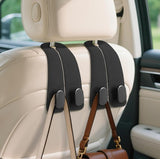 Black PU leather car seat headrest hooks with heavy-duty double metal hooks for organizing bags and bottles