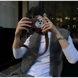 { "alt_text": "Multicolor knitted pocket long case for iPhone, stylish phone accessory, durable carrying solution" }
