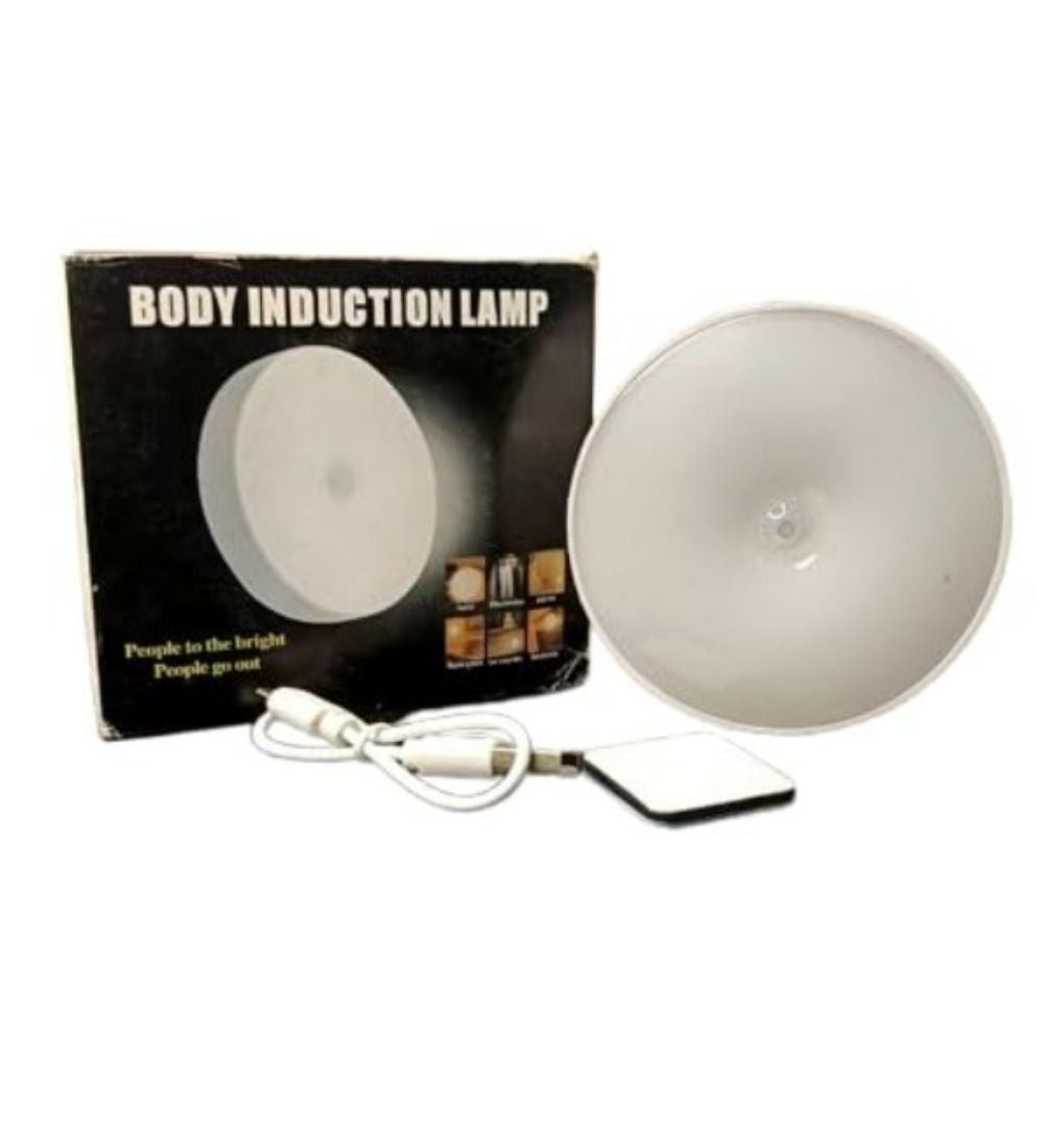 White motion sensor LED light with magnetic attachment for hands-free illumination in dark areas