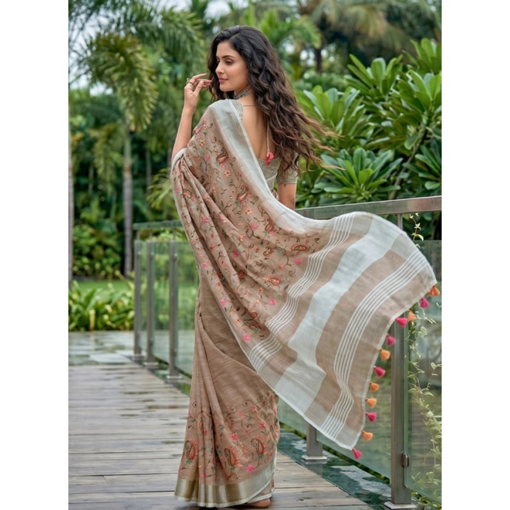 { "alt_text": "Brown linen saree with floral embroidery, unstitched blouse, 5.5Mtr ethnic wear for women" }