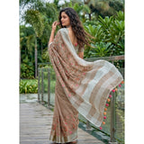 { "alt_text": "Brown linen saree with floral embroidery, unstitched blouse, 5.5Mtr ethnic wear for women" }