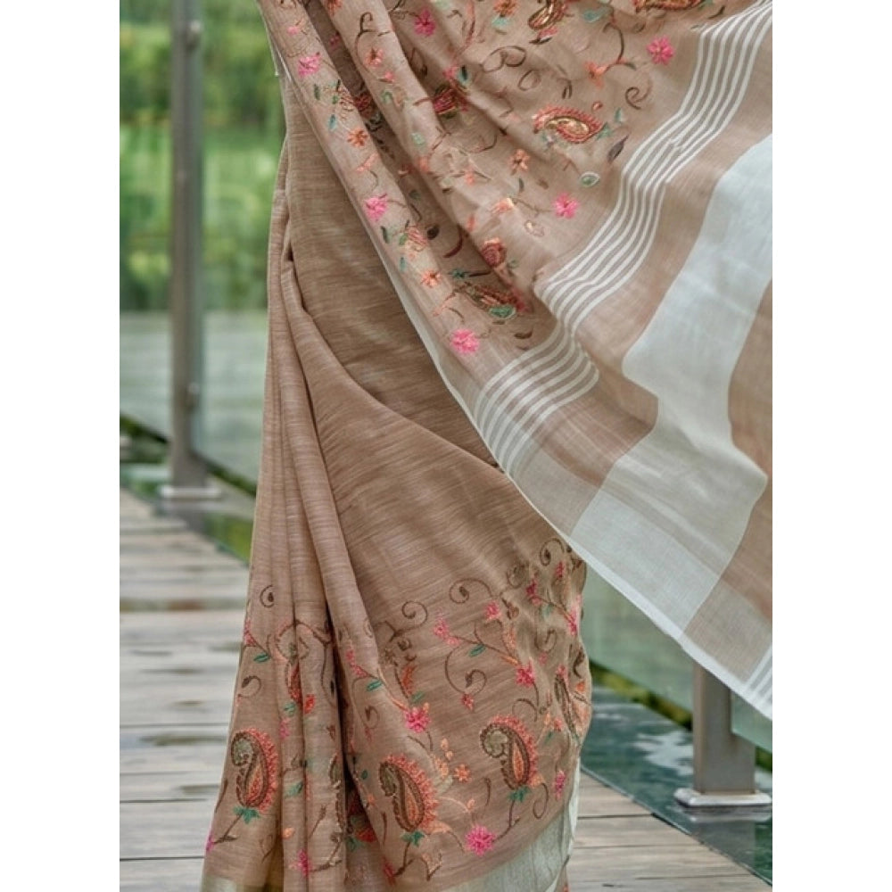 { "alt_text": "Brown linen saree with floral embroidery, unstitched blouse, 5.5Mtr ethnic wear for women" }