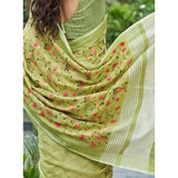 { "alt_text": "Light green linen saree with floral embroidery, unstitched blouse, 5.5m linen ethnic wear for women" }