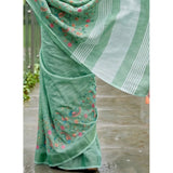 { "alt_text": "Sea Green linen saree with floral embroidery, unstitched blouse, 5.5Mtr ethnic wear for women" }