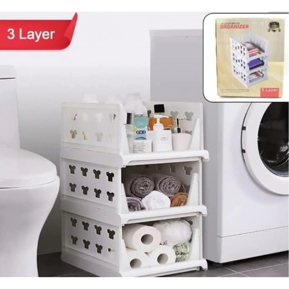 { "alt_text": "White plastic foldable stackable storage organizer for closet organization, easy to store household items" }