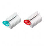 { "alt_text": "Multicolor plastic toothpaste squeezer pack of 2, easy-to-use bathroom hygiene tool" }
