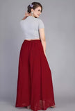 { "alt_text": "Maroon georgette women's palazzo pants, solid high-rise wide leg flared palazzo, ankle length elastic waist" }