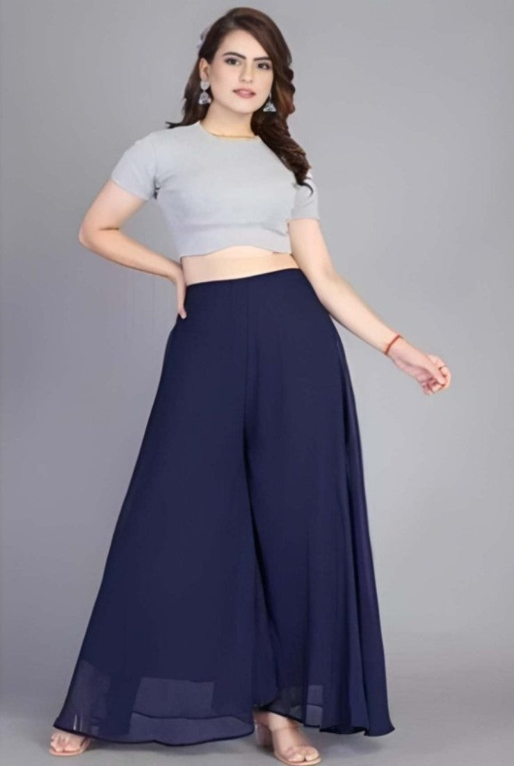 { "alt_text": "Navy blue georgette women's palazzo pants, solid high-rise wide leg flared trousers, ankle length ethnic wear" }