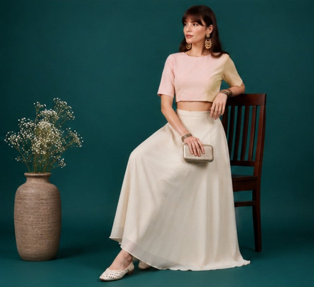 { "alt_text": "Cream georgette women's palazzo pants, solid mid-rise wide leg flared pants, comfortable elastic waist clothing" }