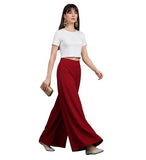 { "alt_text": "Maroon georgette women's palazzo pants, solid wide leg flared pants, mid-rise elastic waist ankle length" }
