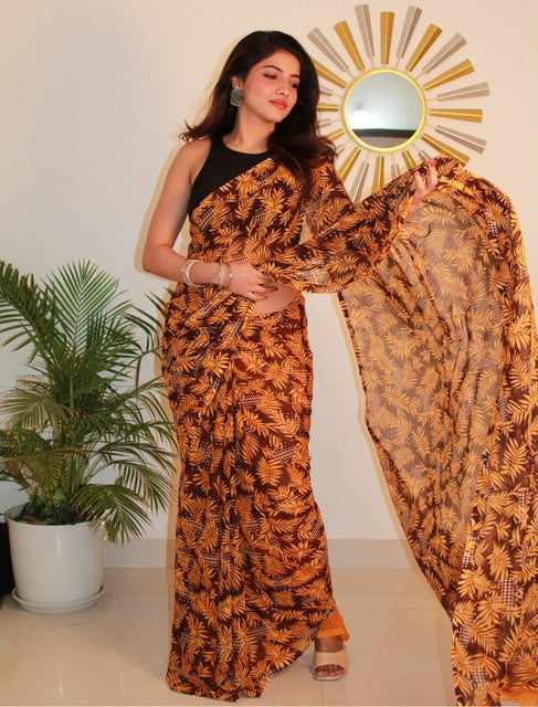 { "alt_text": "Black-yellow georgette printed saree with unstitched blouse, 5.5m, ethnic wear fashion" }